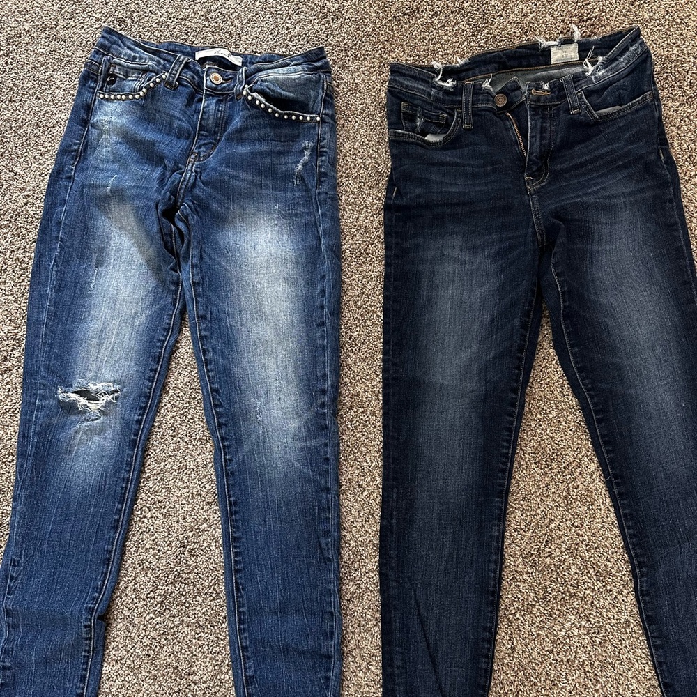 2 pairs of buckle jeans size 26 1-Kancan skinny jeans and 1-bridge by gly